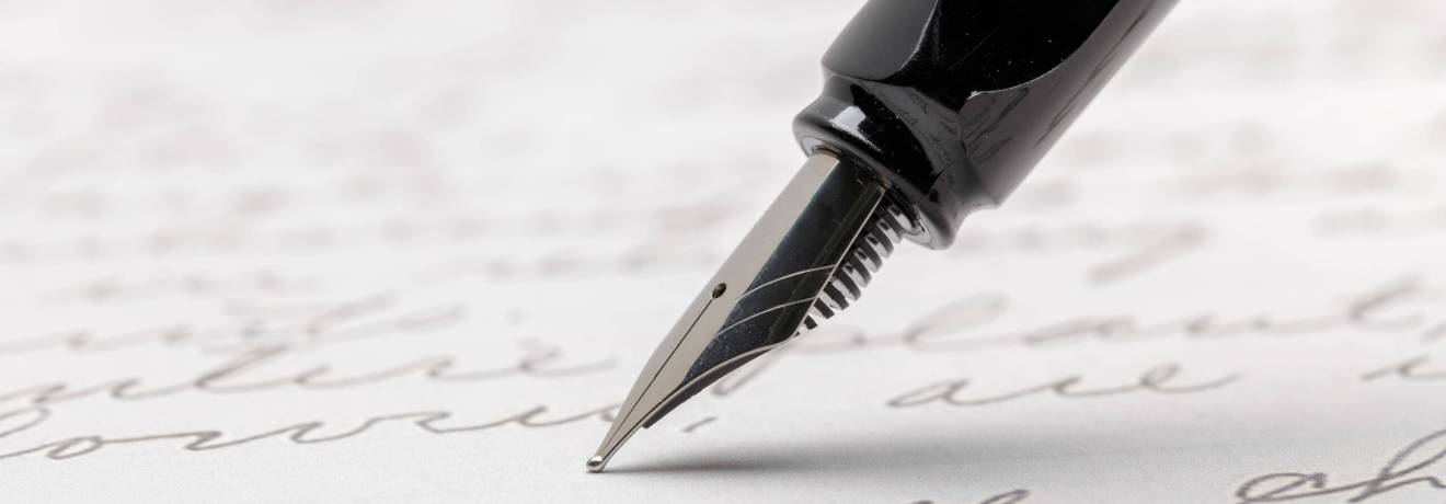 fountain pen on written page 2023 11 27 05 21 55 utc scaled fountain pen on written page 2023 11 27 05 21 55 utc scaled