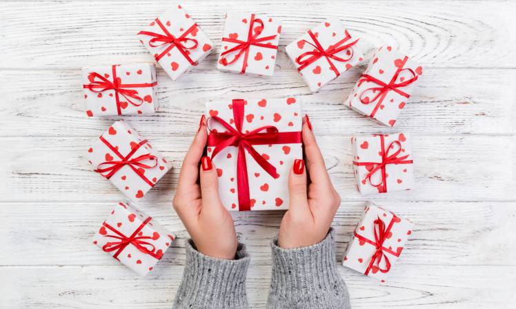 woman hands give wrapped valentine or other holida 2024 10 16 23 23 06 utc scaled
